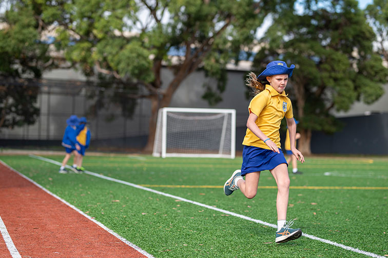 Athletic girl playing soccer